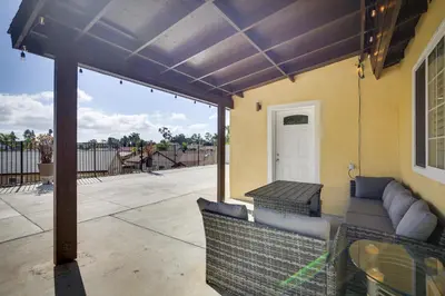 a covered patio with a couch and a table at Centrally Located Retreat 5 Mi to San Diego Zoo! in San Diego