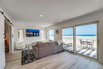 a living room with a couch and a view of the ocean at Life's A Beach 2 in San Diego