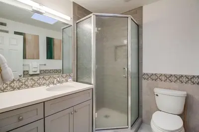 a bathroom with a shower and a toilet and a sink at Life's A Beach 2 in San Diego