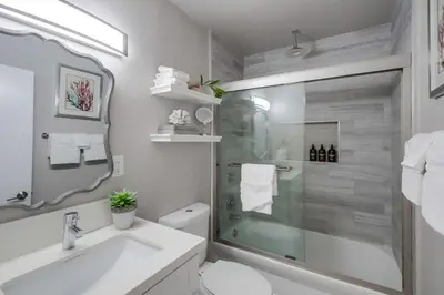 a bathroom with a shower and a toilet and a sink at Salt Life in San Diego