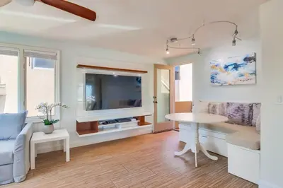 a living room with a couch and a table at Sky High in San Diego