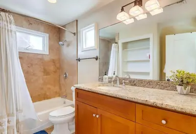 a bathroom with a sink and a toilet and a shower at Sky High in San Diego