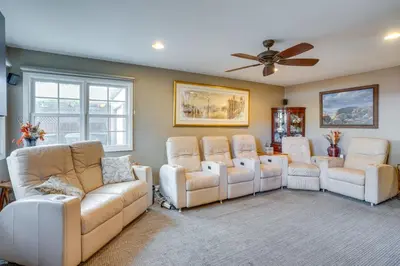 a room with a couch and chairs and a ceiling fan at Costa Mesa Rental with Private Hot Tub and Fire Pit! in Costa Mesa