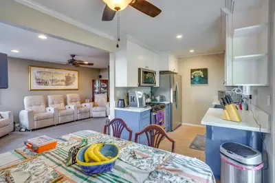 a kitchen and living room with a table with bananas on it at Costa Mesa Rental with Private Hot Tub and Fire Pit! in Costa Mesa