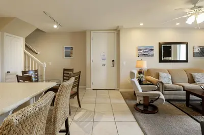 a living room with a couch and a table at Oceanside Beach Condos in Oceanside