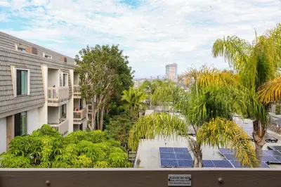 a view from the balcony of a building with solar panels at Oceanside Beach Condos in Oceanside