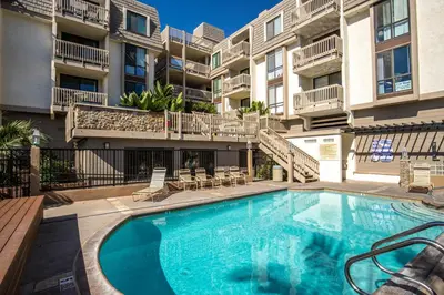 an image of a swimming pool in a apartment building at Oceanside Beach Condos in Oceanside