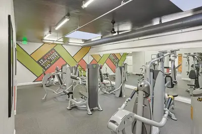 a gym with lots of cardio equipment in a room at Oceanside Beach Condos in Oceanside