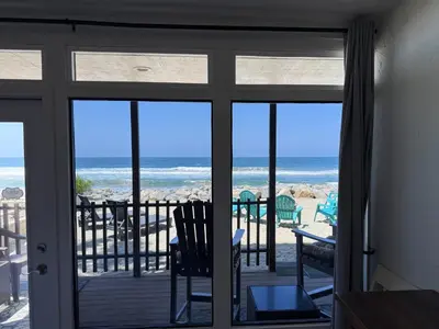 a room with a view of the ocean from a door at Beachfront Retreat in Oceanside