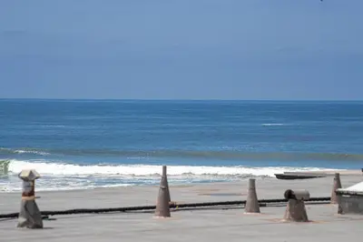a beach with some cones on the sand and the ocean at Oceanside Beach Condos in Oceanside