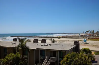 a house with a view of the beach at Oceanside Beach Condos in Oceanside