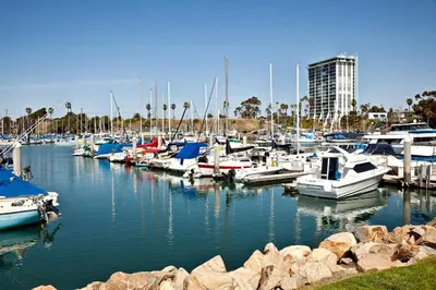 a bunch of boats are docked in a marina at Oceanside Beach Condos in Oceanside
