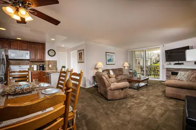 a living room with a kitchen and a dining room at Oceanside Beach Condos in Oceanside
