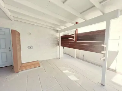 an empty room with a staircase in a house at Beach Bungalow #3 in Newport Beach (A/C Included) in Newport Beach