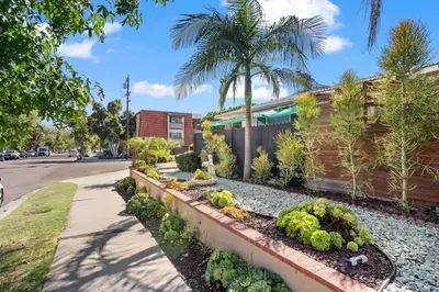 a garden of vegetables and plants on a street at Cozy, home with hottub and patio in San Diego