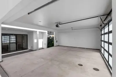 an empty room with white walls and windows at Modern, Spacious, home w rooftop view in San Diego