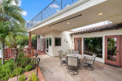 a house with a patio with a table and chairs at Casa Solana water views family friendly in Solana Beach