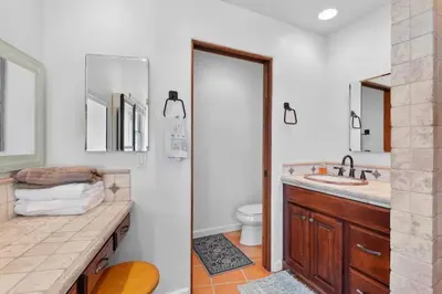 a bathroom with a sink and a toilet at Casa Solana water views family friendly in Solana Beach