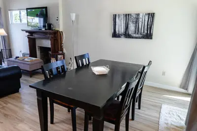 a black table and chairs in a living room at Monthly rental, Coronado Resort Style Town Home in San Diego