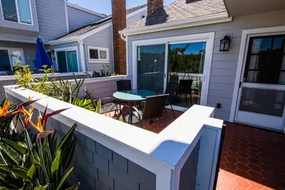 a patio with a table and chairs on a house at Monthly rental, Coronado Resort Style Town Home in San Diego