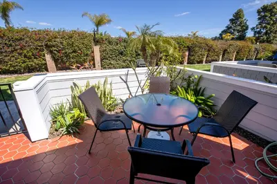 a patio with a table and chairs on a patio at Monthly rental, Coronado Resort Style Town Home in San Diego