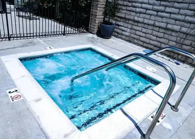 a swimming pool with a metal rail around it at Monthly rental, Coronado Resort Style Town Home in San Diego