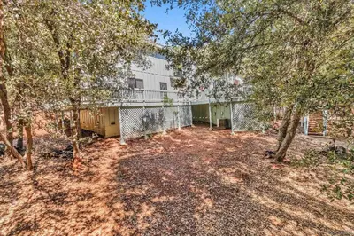 an open yard with trees in front of a building at The Bungalow Partial Home Rental in Julian
