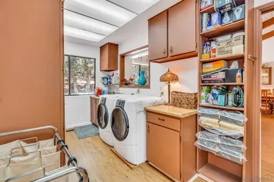 a laundry room with a washer and dryer at The Bungalow Partial Home Rental in Julian