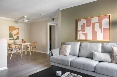 a living room with a couch and a table at Rancho Penasquitos 1br w pool gym nr bars SAN-31 in San Diego