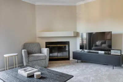 a living room with a chair and a fireplace at Rancho Penasquitos 1br w pool gym nr bars SAN-31 in San Diego