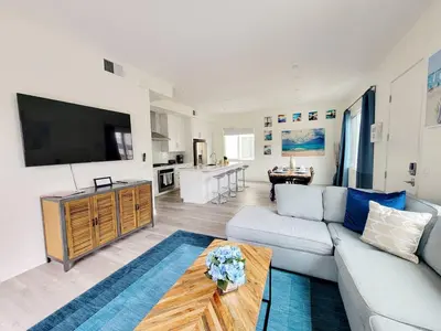 a living room with a couch and a table at Upscale Modern Townhouse at Balboa Park in San Diego