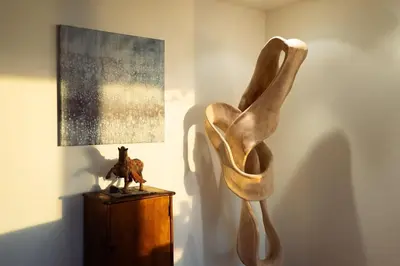 a sculpture of a woman on a table next to a lamp at Sunset Serenity On The Cliffs - Balcony- Oceanview in San Diego