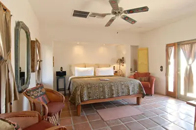 a bedroom with a bed and a ceiling fan at Borrego Valley Inn in Borrego Springs