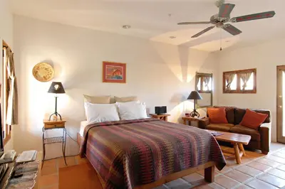 a bedroom with a bed and a couch at Borrego Valley Inn in Borrego Springs