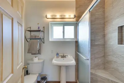 a bathroom with a sink and a toilet and a shower at Downtown Carlsbad Apartment Less Than half Mi to Beach! in Carlsbad
