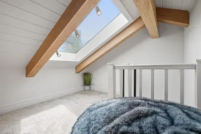 a attic room with a skylight at Neptune Hidden Gem in Encinitas