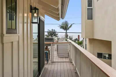 a balcony with a view of a building at Neptune Hidden Gem in Encinitas