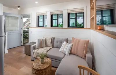 a living room with a couch and a table at Neptune Charm in Encinitas
