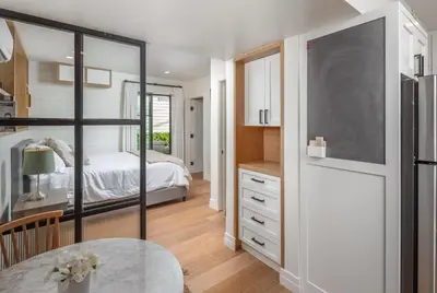 a bedroom with a bed and a table at Neptune Charm in Encinitas