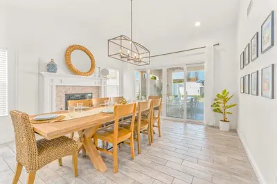 a dining room with a table and chairs at Villa Descanso in Oceanside