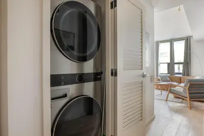 a wall mounted oven with a microwave in a living room at East Village 1br w spa media room nr stadium SAN-37 in San Diego