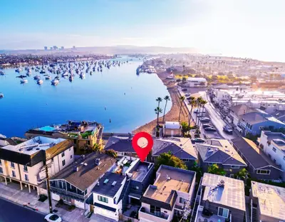 an aerial view of a city with a red marker at Luxury 2BR Steps to Beach & Pier with AC plus Garage Parking in Newport Beach