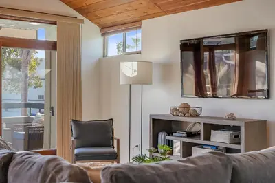 a living room with a couch and a chair at Stunning South Mission Beach Home - AC, Private Patio, Grill and Garage! in San Diego