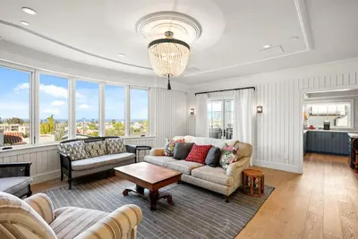 a living room with a couch and a table at Cabrillo Villa - Massive 7br La Jolla Estate in San Diego