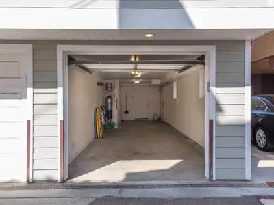 an empty garage with a car parked in it at Kennebeck Oasis - Private Patio, Steps 2 Sand & AC in San Diego