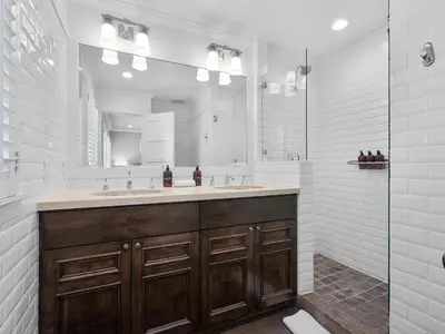a bathroom with a sink and a mirror at Kennebeck Oasis - Private Patio, Steps 2 Sand & AC in San Diego
