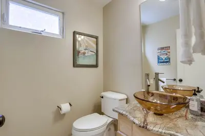 a bathroom with a copper sink and a toilet at Stunning Ocean View Home w Rooftop Terrace, Firepit, Fast Wifi, AC & Parking! in San Diego