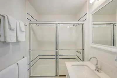 a bathroom with a shower and a sink at Beautiful Beach Home - Ocean View, AC & Patio in San Diego