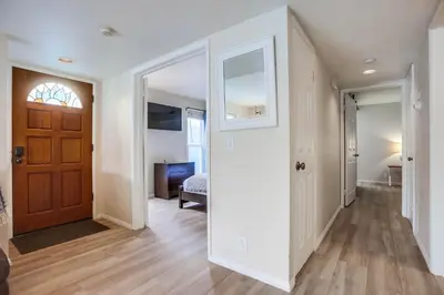 an empty hallway with a door and a bedroom at Ormond Beach Oasis - Large Private Patio, WasherDryer, Pet Friendly & Steps2Sand! in San Diego