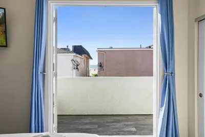 an open door to a balcony with a view at Ocean View Paradise w Private Patio & Spa in San Diego